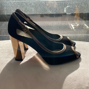 Black suede and gold open toe pump